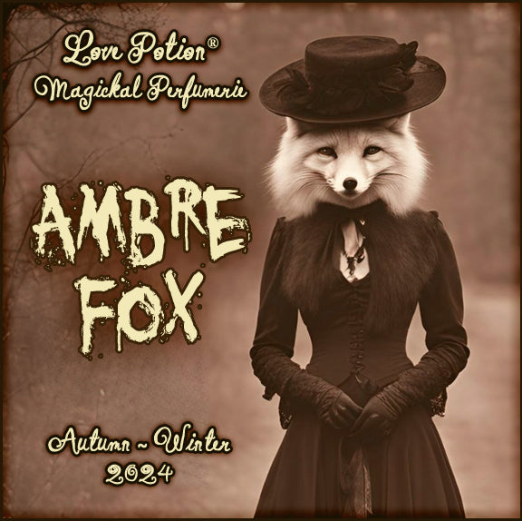 Ambre Fox perfume combines amber resins with light citrus for personal prosperity. Label features a fox in a dress.