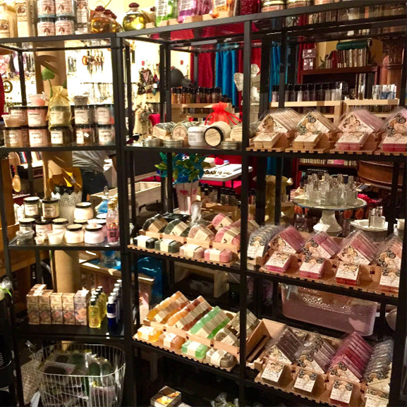 Bath and body products on display in our store, including body scrubs, creams, salt soaks, and more! Scented with classic and original Love Potion fragrances.