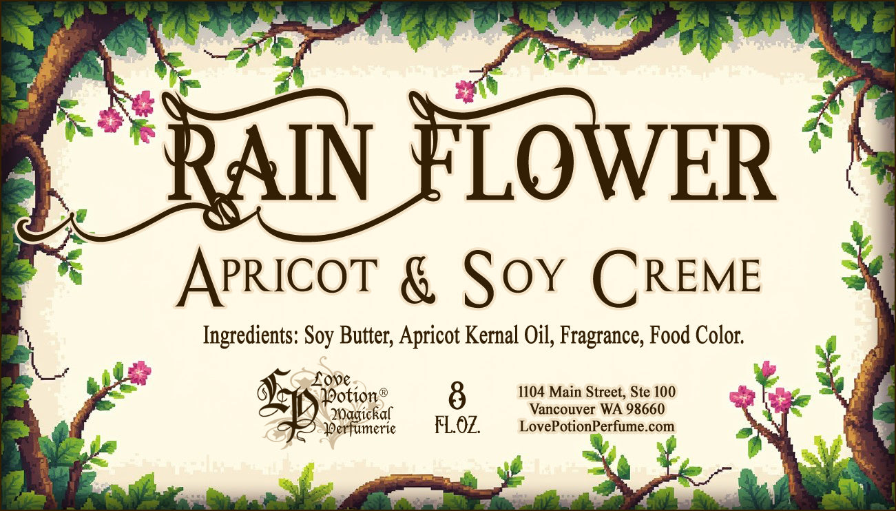 Label for apricot and soy creme. This body cream is scented like rainforest flowers and the label art features branches with leaves and pink flowers.