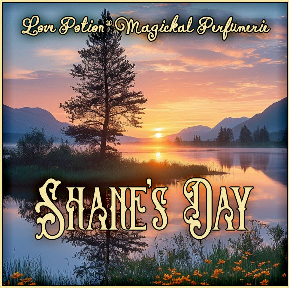 Shane’s Day perfume encapsulates morning ease and smells of tea. The label art shows sunrise on a still lake with a tree.