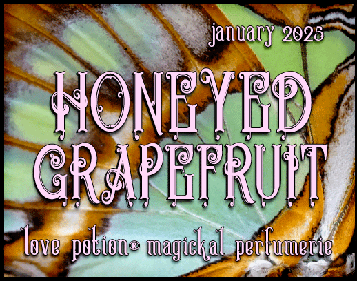 Honeyed Grapefruit layerable perfume by Love Potion. Label shows green and orange butterfly wings.