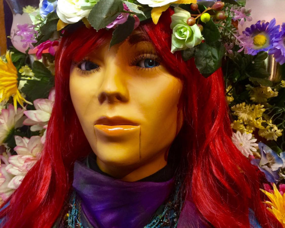 Brigid, the mechanical fortune teller built by the love potion team, greets visitors at our shop.