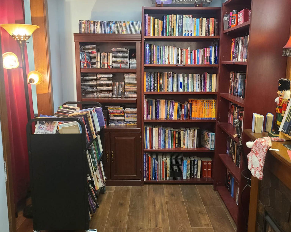 Next to our used books are shelves displaying various DVDs of popular movies for sale.