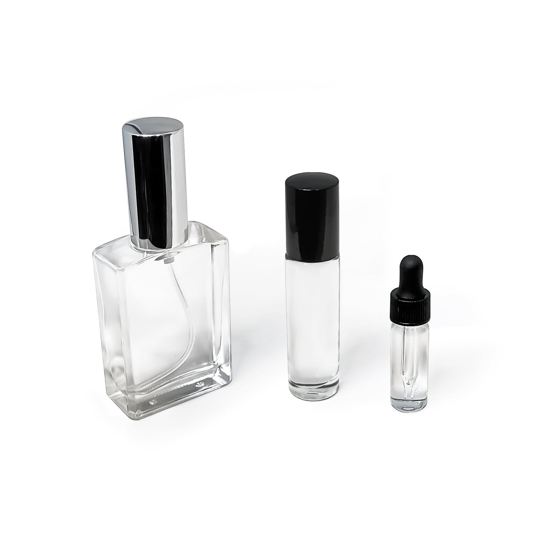 Set of three clear glass pheromone bottles in different sizes on a white background.