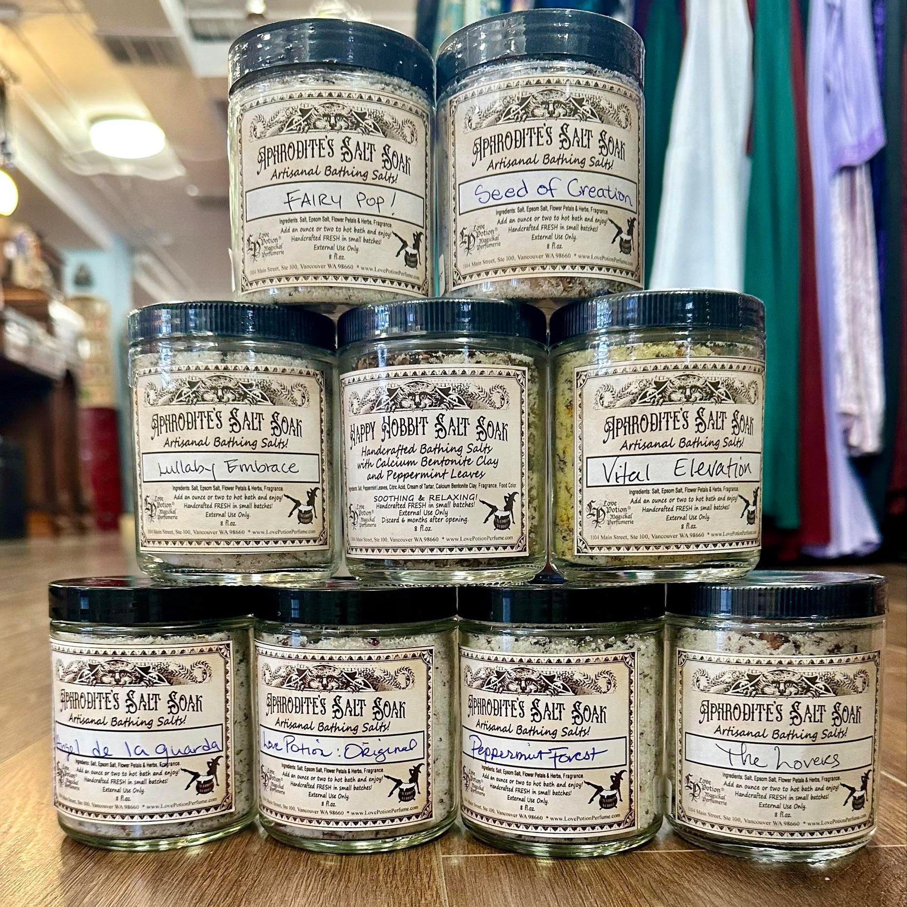 A tower of sample handmade salt soaks featuring a range of scents and intentions