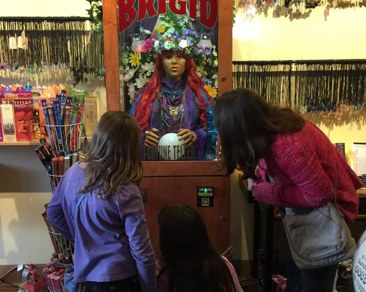 Children getting their fortunes told by Brigid, our mechanical fortune teller, in the Love Potion store.