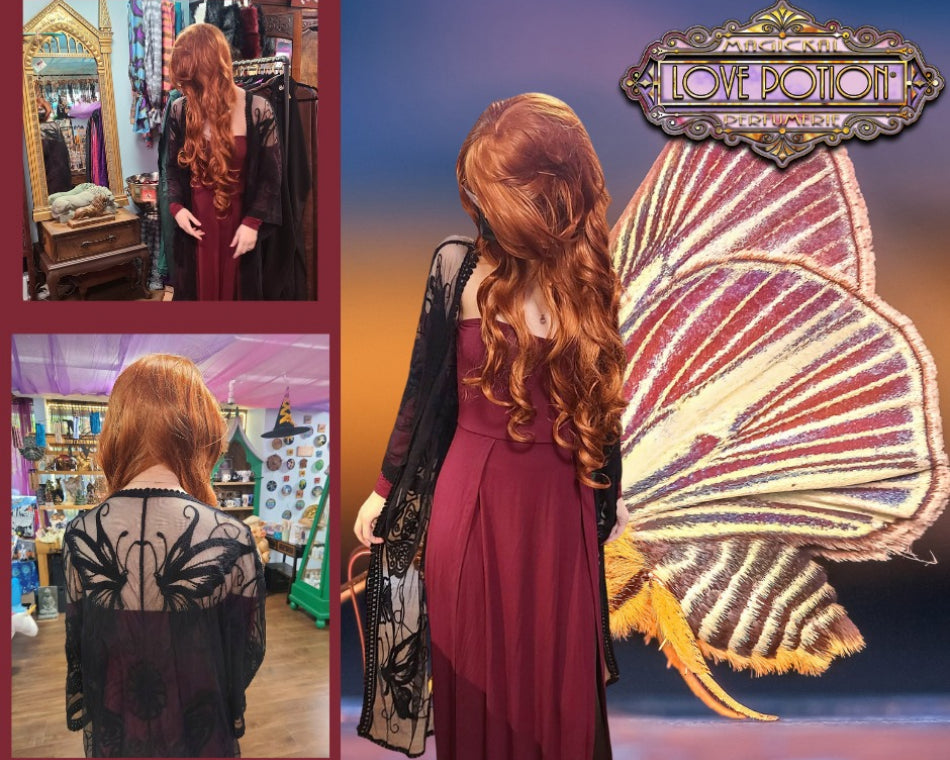 Val showcases a deep wine red dress and black lace shawl adorned with a butterfly design.