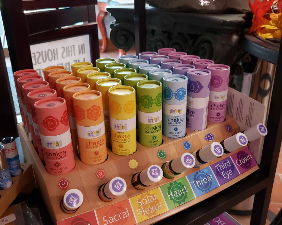 A range of Chakra oils. They are in a rainbow display. Each oil corresponds with the color and meaning of the associated chakra.