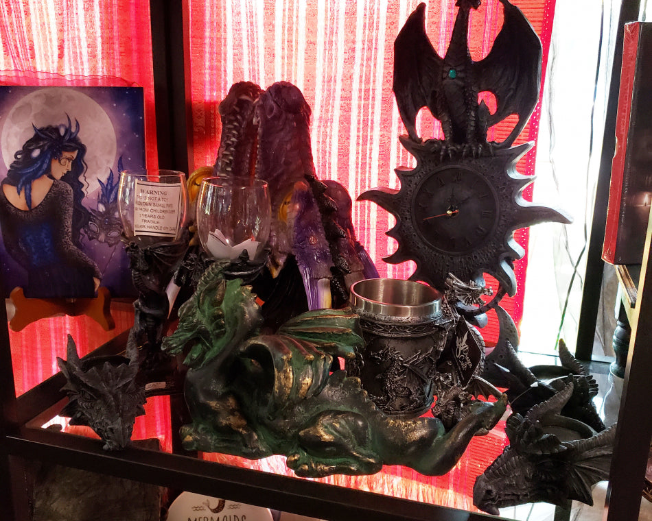 A wide variety of dragon pieces available. This is an image of dragon items on a shelf.
