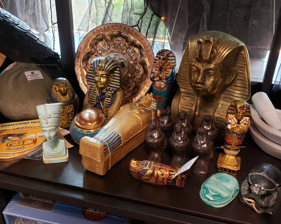 Egyptology decorations and statues on display within our coexist section.