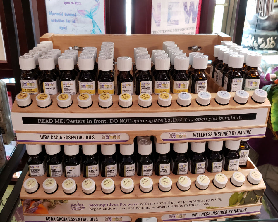 Display showing a range of essential oils used for body care.