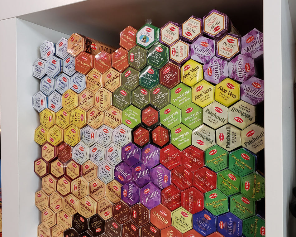 Our range of single-note incense displayed on a cube shelf. Additionally, we offer a diverse selection of more intricate scents.