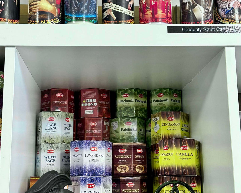 Incense cone boxes, incense burners, and candles adorned with characters and celebrities.