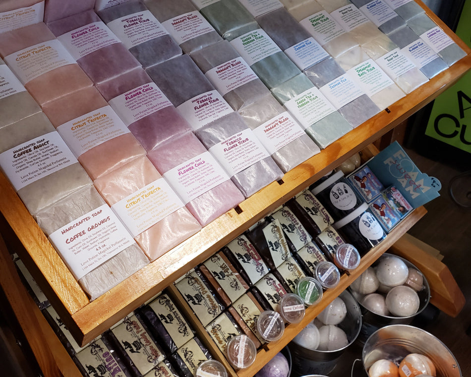 Luxurious Bath Products: Scrubs, Soaps, and Bath Bombs on display.
