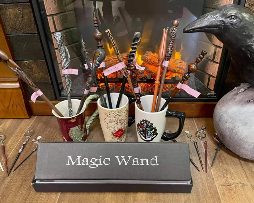 The picture showcases Harry Potter-inspired cups and wands neatly arranged in front of a cozy fireplace.