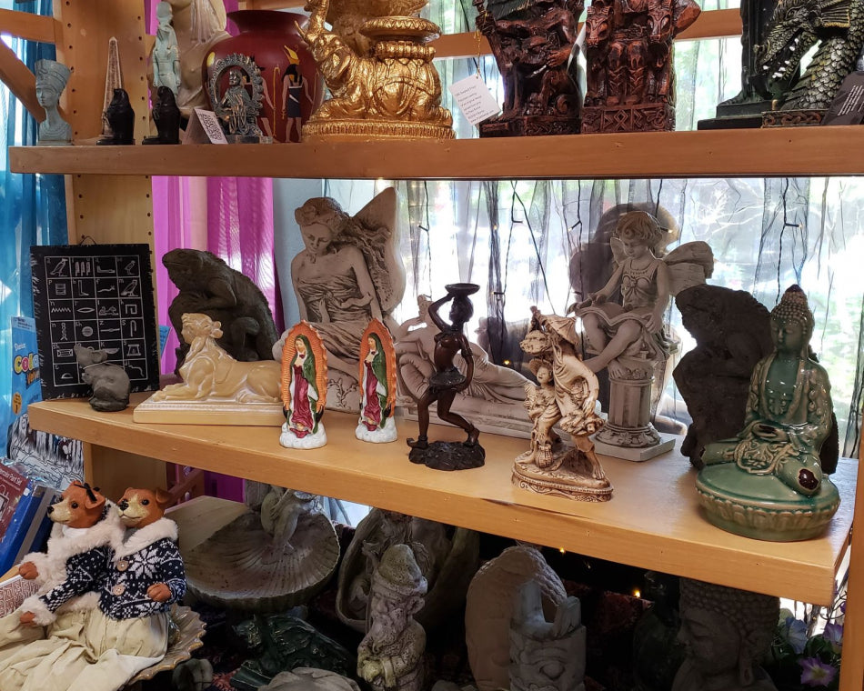 Taking a closer look at our statues in the garden section of the store.