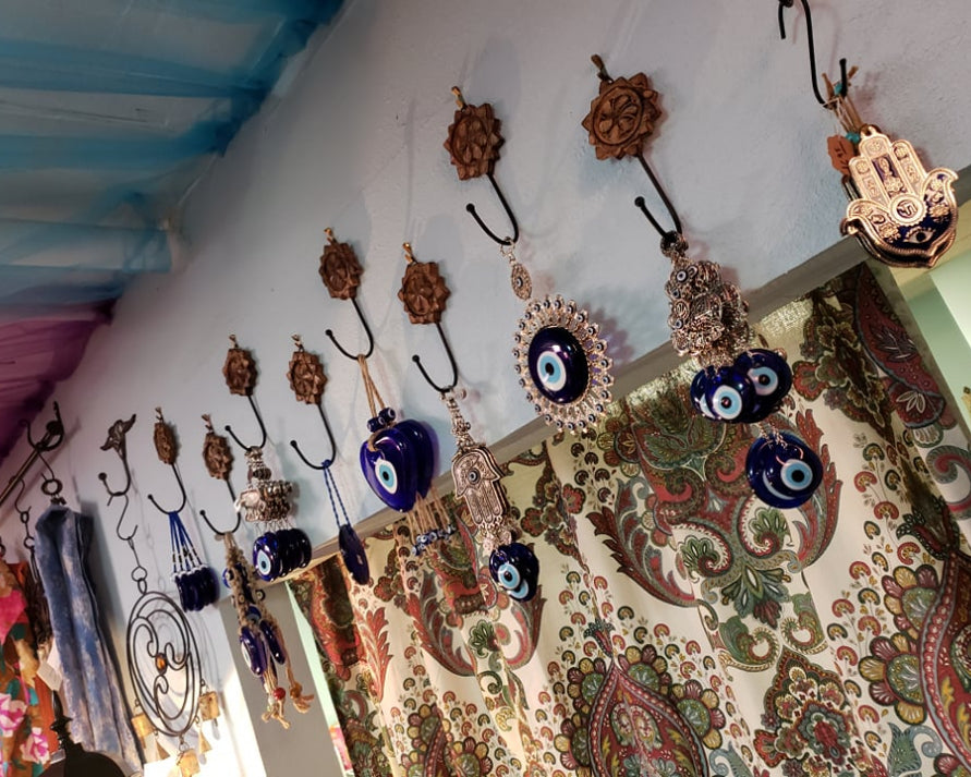 Decorate and protect your space with our range of Nazar and Hamsa evil eye protection wall decorations.