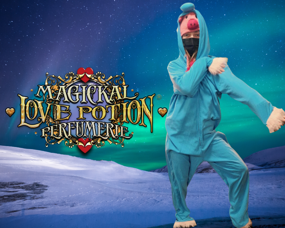 Kaytlin in a teal unicorn onesie with a rainbow mane. One of many onesie pajama outfits.