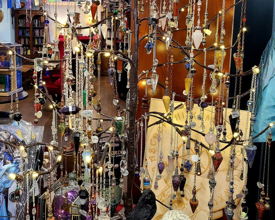 This is an image of our Pendulum tree. It is a metal tree holder for our hand made pendulums to hang on for display.
