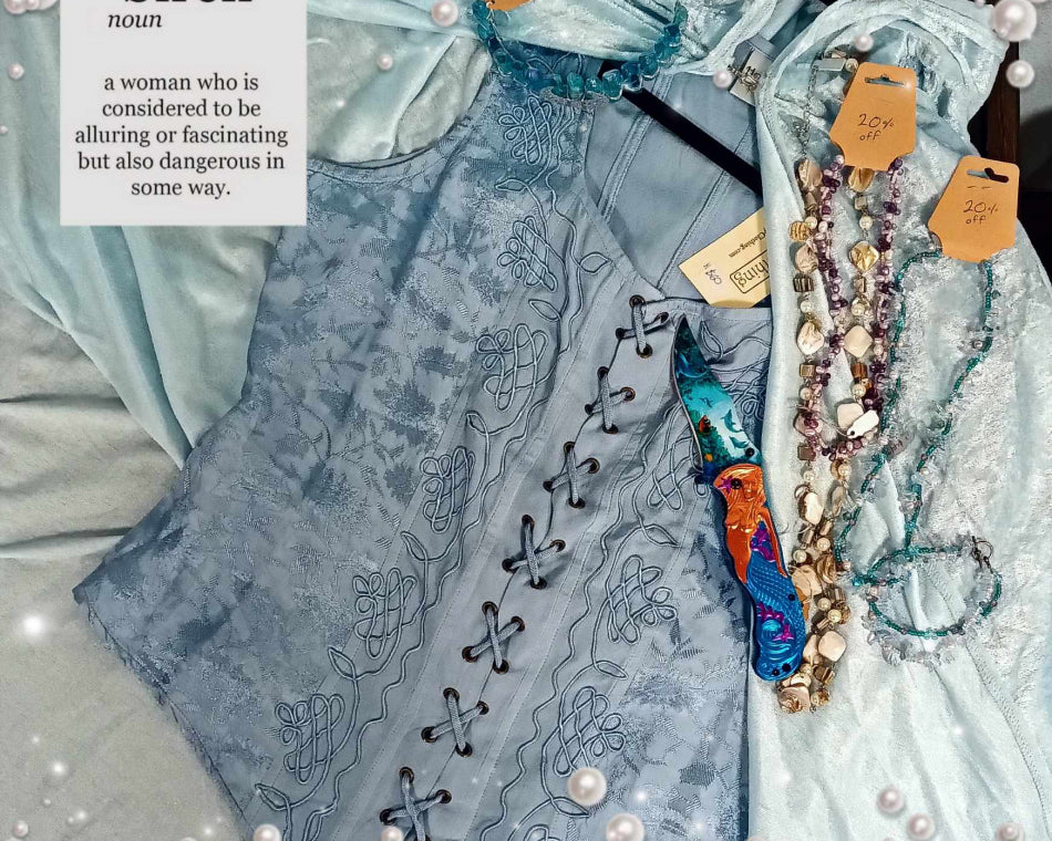 Soft blue corset and cape, seashell jewelry, mermaid pocket knife, and blue crystal crown.
