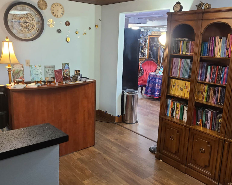 This wall of the book room features a collection of steampunk gears and clocks.