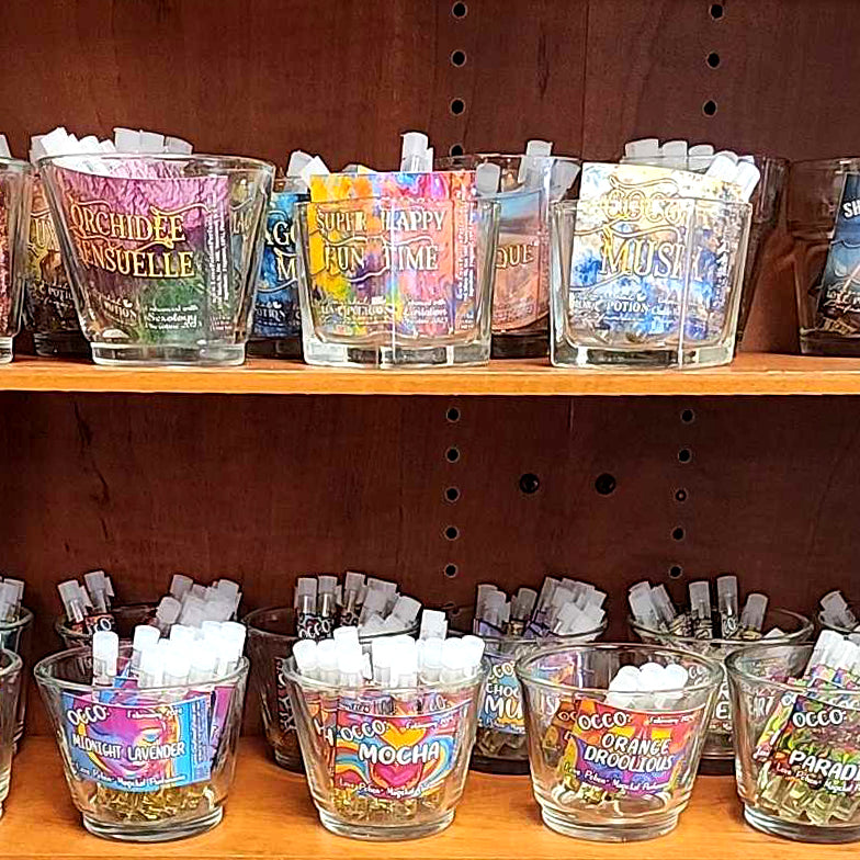 Trial vials of various artisan clean perfumes and pheromones on display in our magickal marketplace store.