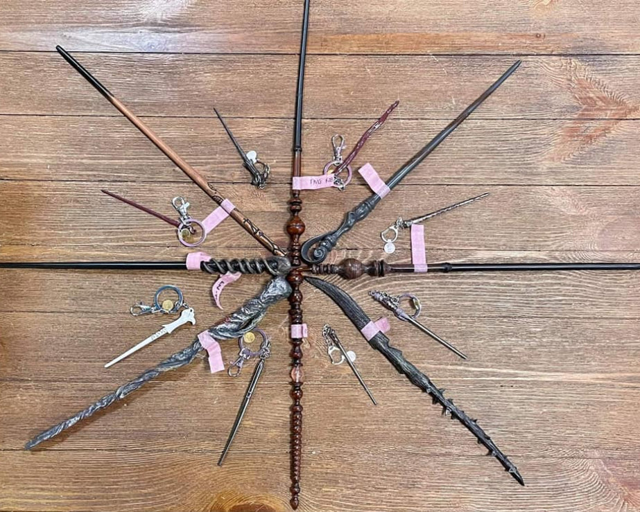 A collection of wands and keychains styled after famous character wands in the world of Harry Potter.