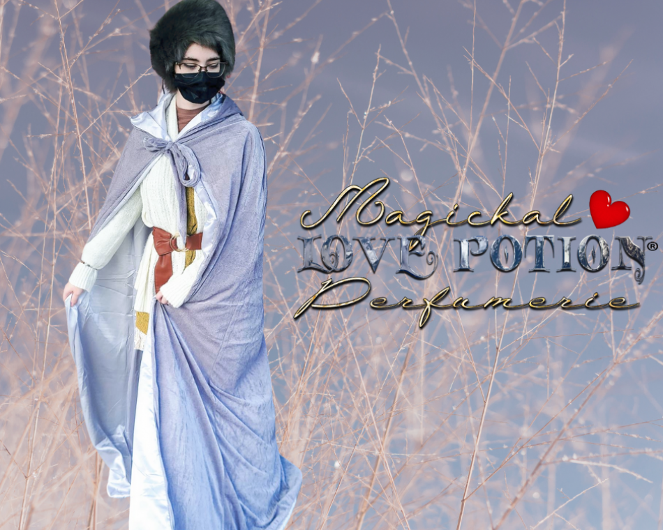 Val wears an ice blue robe and dark brown faux fur hat in winter.