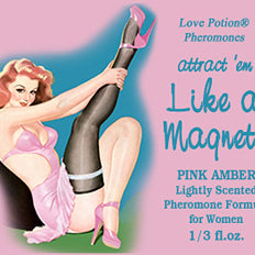 Like a Magnet pheromone oil with pink amber fragrance label shows a pinup girl in pink and black