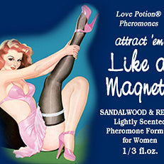 Like a Magnet pheromone oil with sandalwood and resin fragrance label shows a pinup girl in pink and black
