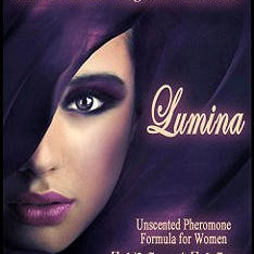 Love Potion: Lumina pheromone label featuring face of beautiful woman who appears to be glowing from within purple fabric.