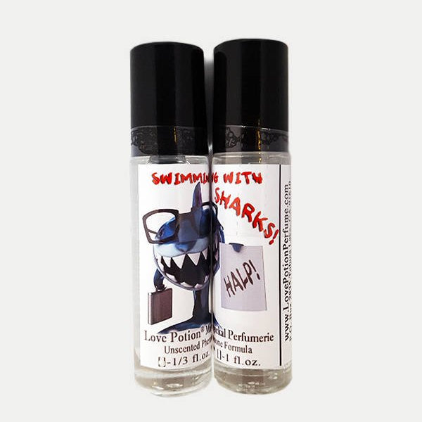 Photo of labelled Swimming with Sharks pheromone bottles.