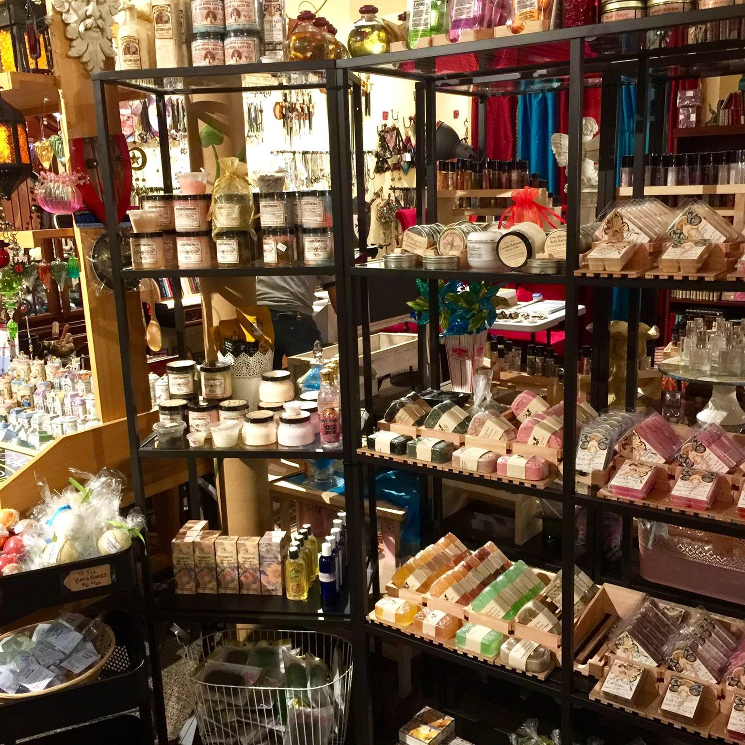 Shelves of various bath and body products available in our marketplace that feature Love Potion #9