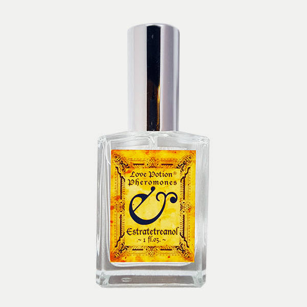 Love Potion Pheromone label featuring text on aged parchment background on a glass spray bottle.