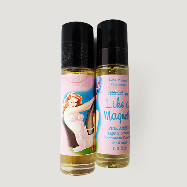 Like a Magnet pheromone oil with pink amber fragrance in a labeled roll-on application bottle.