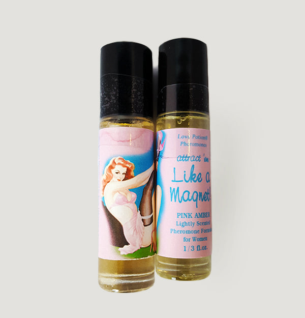 Like a Magnet pheromone oil with pink amber fragrance in a labeled roll-on application bottle.