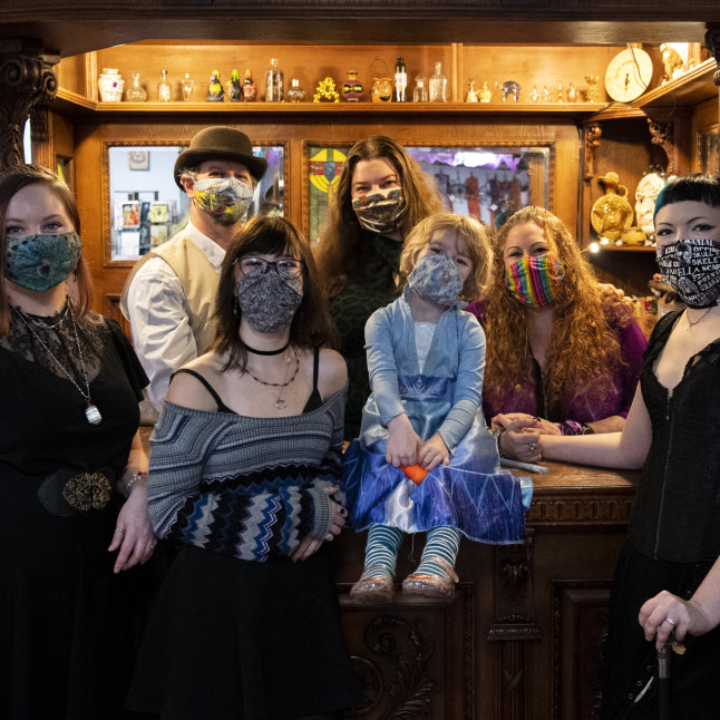 Group employee photo at Love Potion Magickal Marketplace, including the label girl.