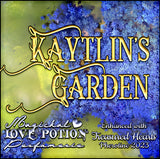 Kaytlin’s Garden with Treasured Hearts berry and flower pheromone perfume. Label art shows a tropical coastline.