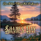 Shane’s Day perfume encapsulates morning ease and smells of tea. The label art shows sunrise on a still lake with a tree.