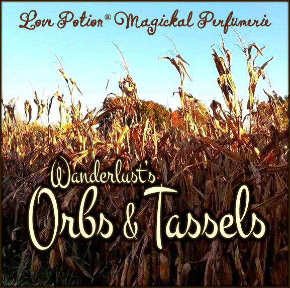 Wanderlust’s Orbs & Tassels autumn apple cider and harvest breeze clean perfume. Label features swaying cornstalks.