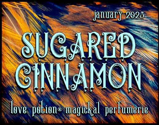 Sugared Cinnamon layerable perfume by Love Potion. Label shows orange and black feathers.