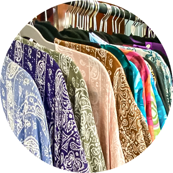 Thumbnail for the clothing and costume section of our store gallery. Shows some of our summer shrugs hanging on a rack.