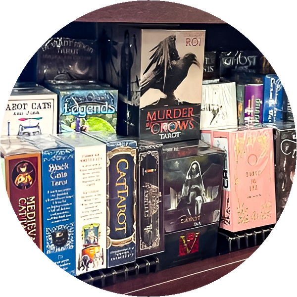 Thumbnail for the divination section of our store gallery. Shows a variety of tarot card decks on shelves.