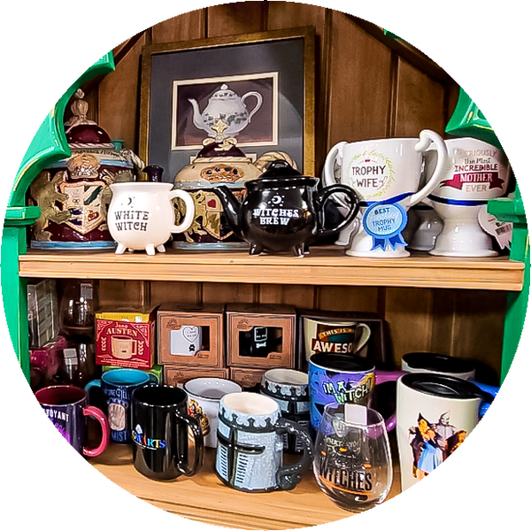 Thumbnail for the earthenware section of our store gallery. Shows tea pots and mugs with fun art and phrases.