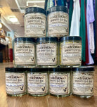 A tower of sample handmade salt soaks featuring a range of scents and intentions