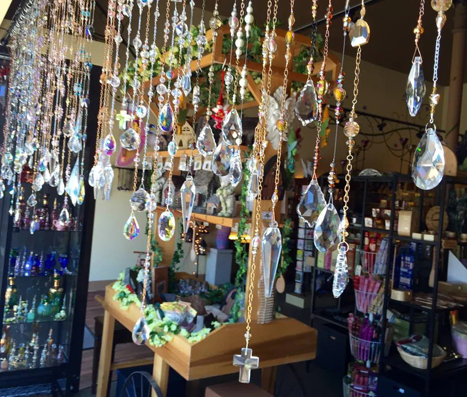 Crystal pendant sun catchers hanging by the window at our shop.