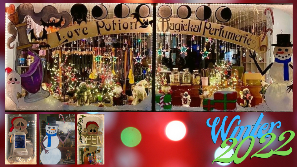 Window display for Love Potion Magickal Perfumerie during Christmas, featuring snowmen, ghosts, bats, presents, and more.