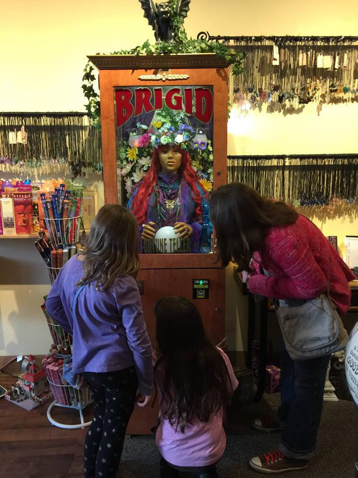 Children getting their fortunes told by Brigid, our mechanical fortune teller, in the Love Potion store.