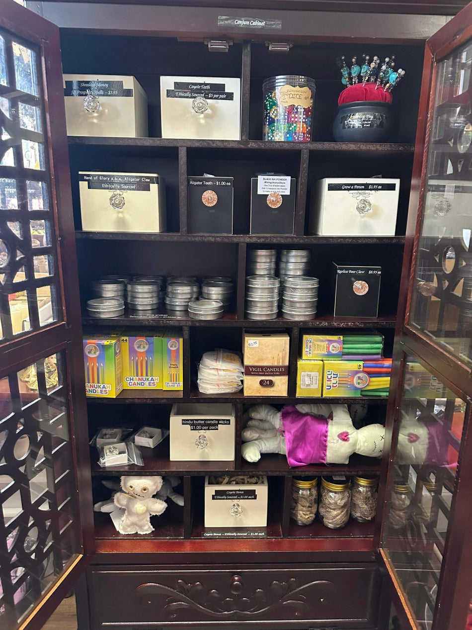 Conjure Cabinet containing a variety of odds and ends used in voodoo and and other religious practices.