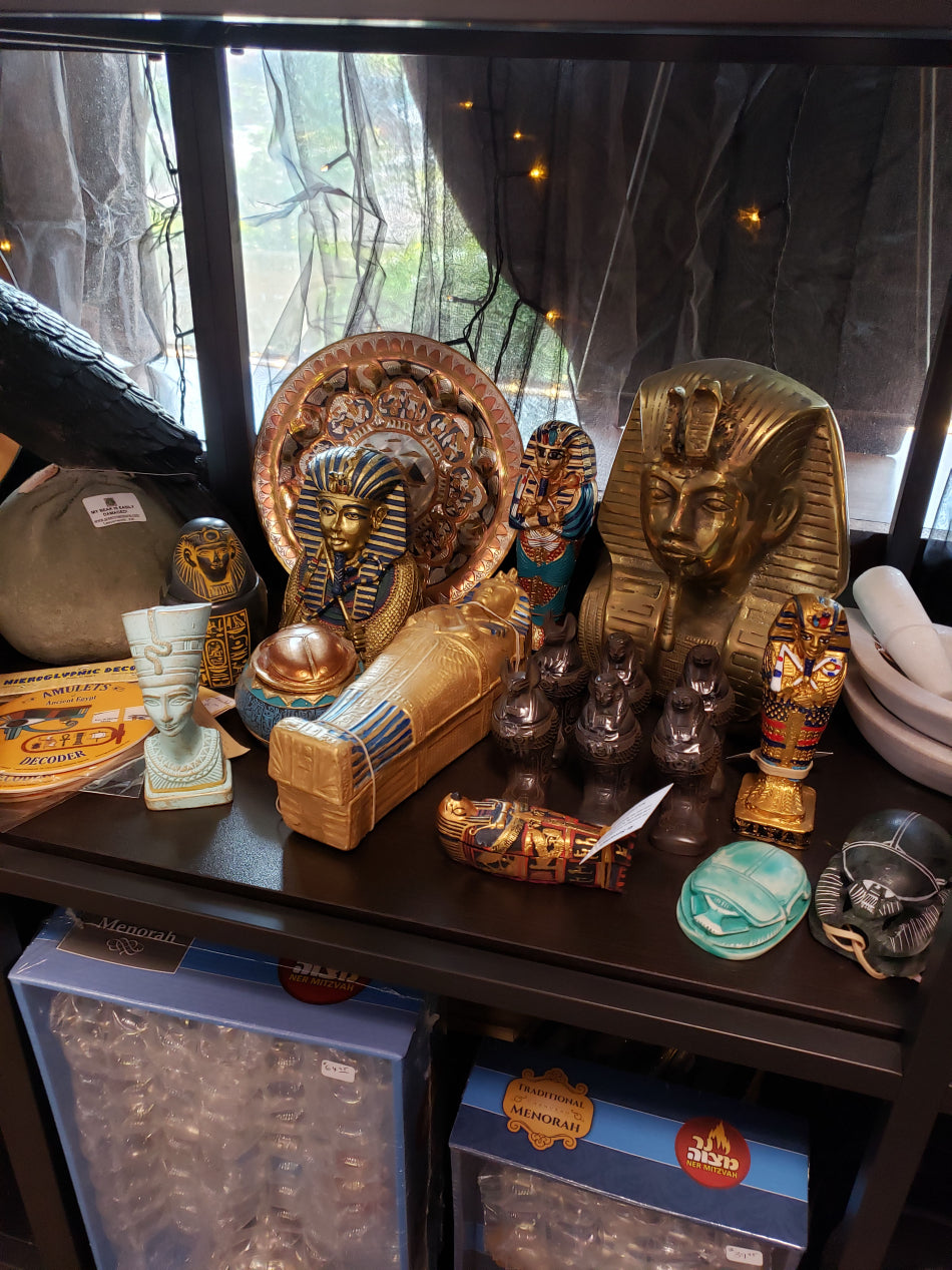 Egyptology decorations and statues on display within our coexist section.